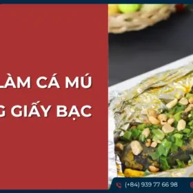 Cá mú nướng giấy bạc đã chín, được đặt trên đĩa, có thể có thêm rau thơm hoặc nước chấm.